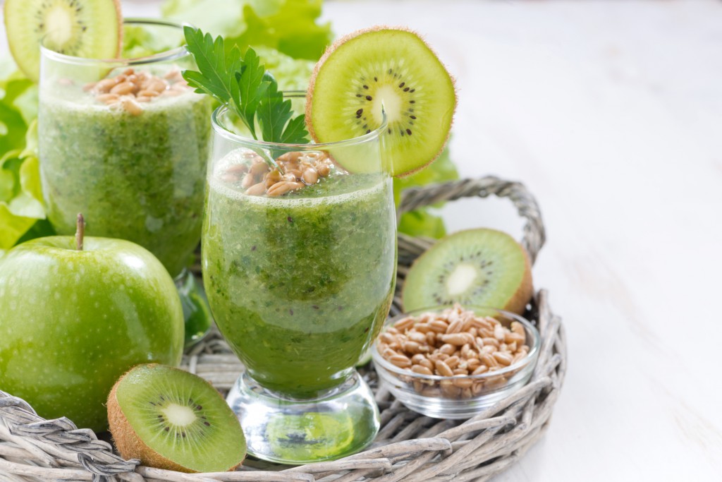 healthy green smoothie with sprouts and fresh ingredients